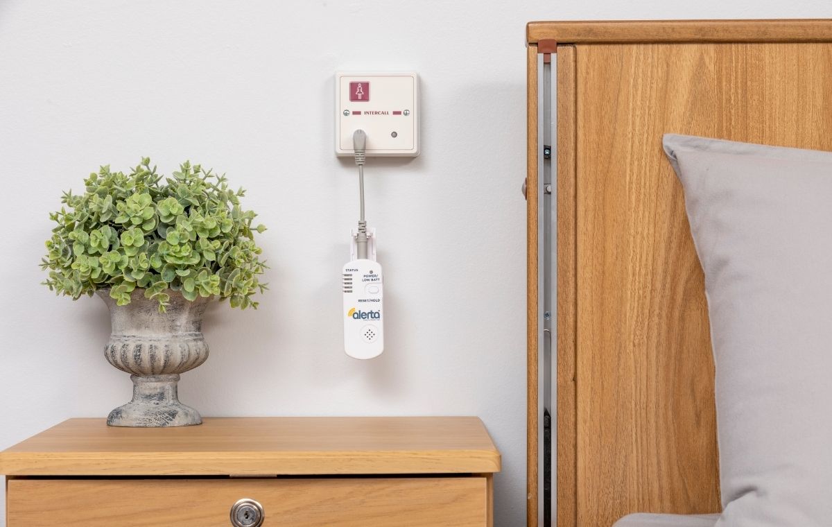 alerta wall point receiver connected to a nurse call system on the wall